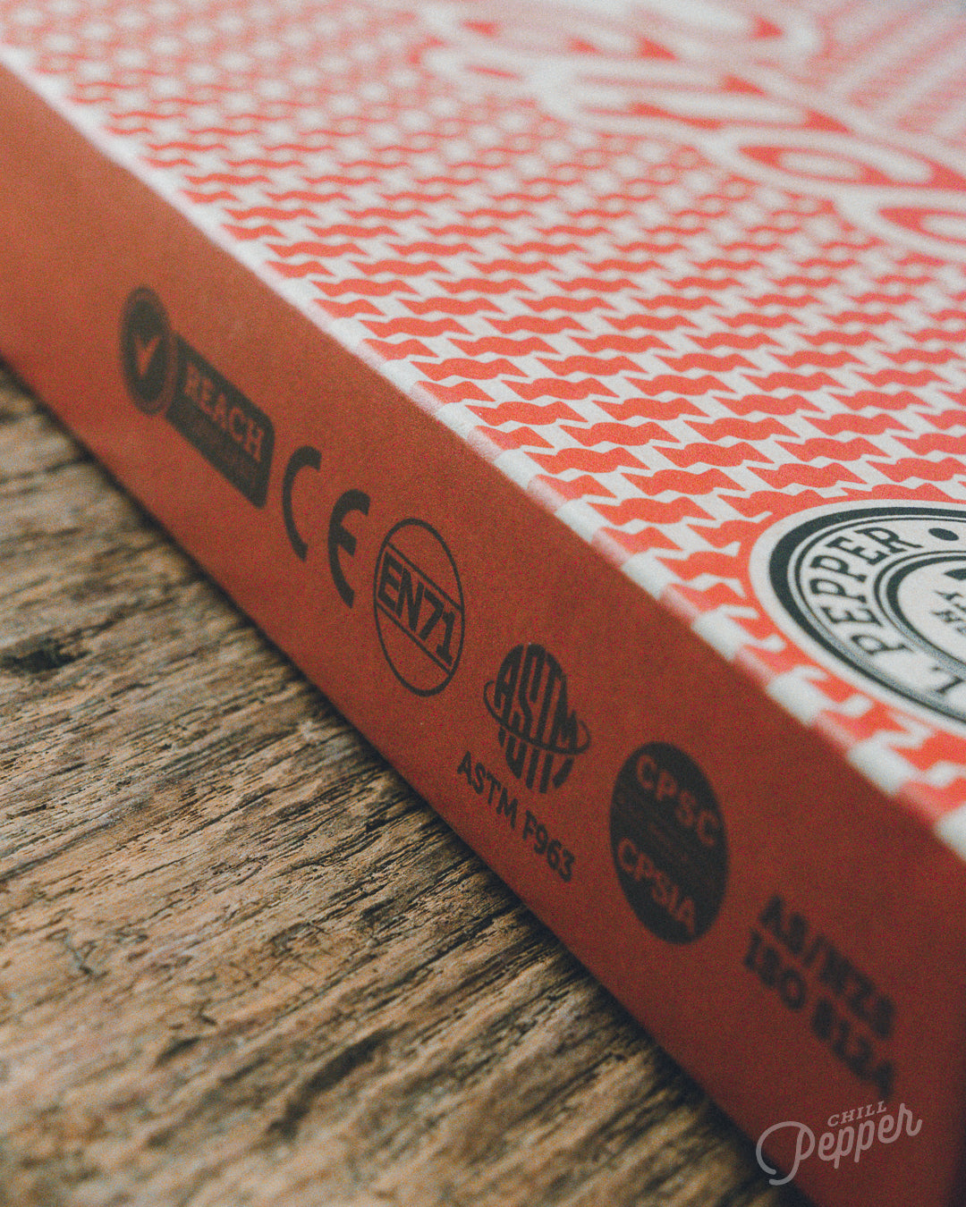 Chill Pepper Sweets Wooden Stacking game - Closer look at the back of the box showing all safety certifications like CE, EN71, ASTM, CPSIA, AS/NZS and REACH