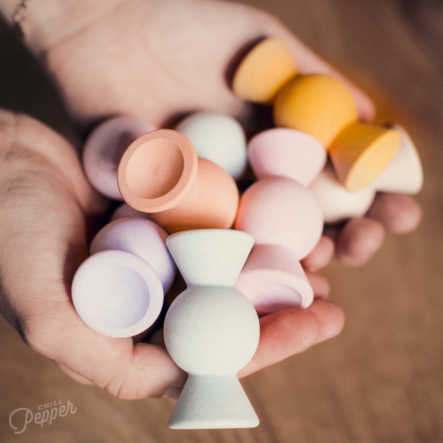 Hand held Chill Pepper open ended wooden toys shaped like candy for free creative play. A made in Europe wooden stacking game. 