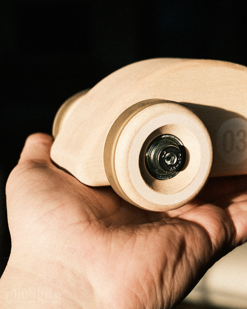 A closer look of the big wheels and heavy duty hardware of the Chunkies Model 03 the Bug. A curvy natural maple wooden car designed in The Netherlands and made in Germany. All shipped from our own workshop in Holland